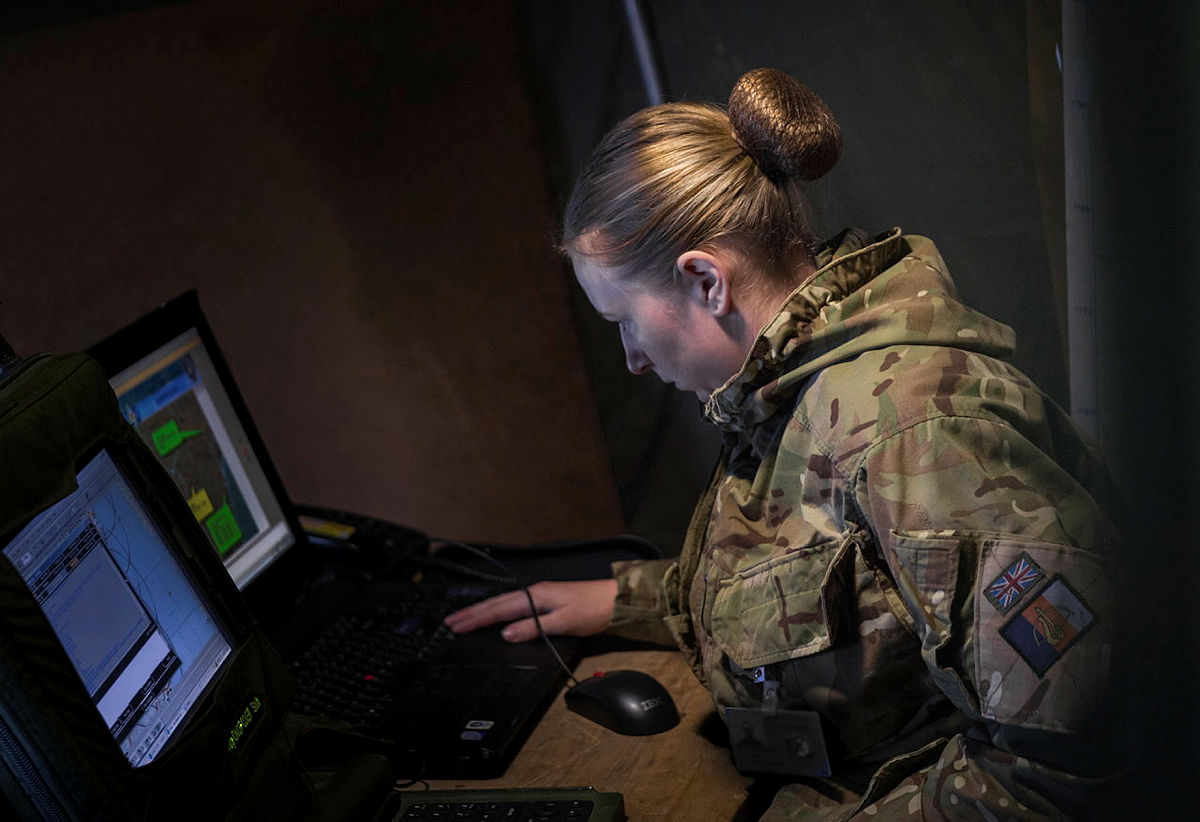 Servicewoman working on a computer.