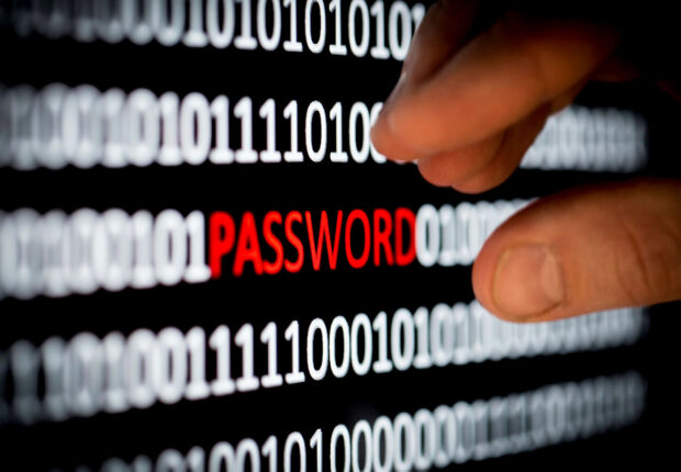 password spelt out around binary code.